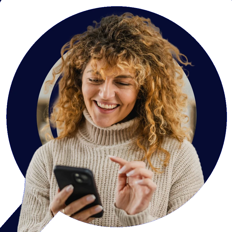 Smiling woman using her phone